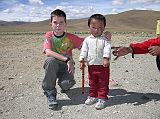 Tibet Kailash 03 Nyalam to Peiku Tso 07 Shishapangma Checkpoint Peter and Dawa The same caretaker was at the Shishapangma Checkpoint as in 2005. We were pleased to again meet their son Dawa, who is now 2 � years old.